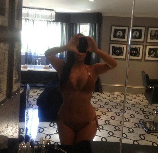 Kim Kardashian takes a bikini photograph in the mirror