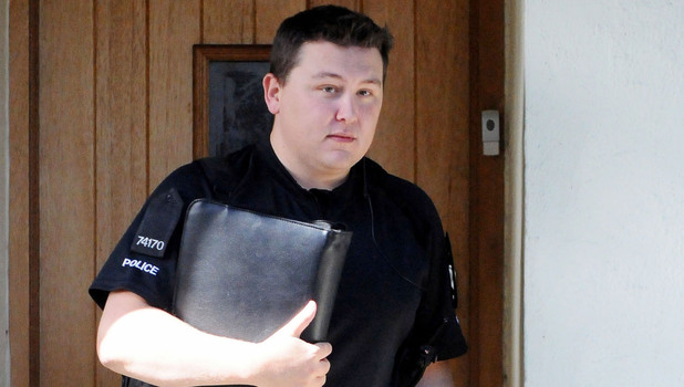 A policeman leaves the home of Chantelle Houghton and Alex Reid
Essex, England - 05.09.12
Mandatory Credit: WENN.com