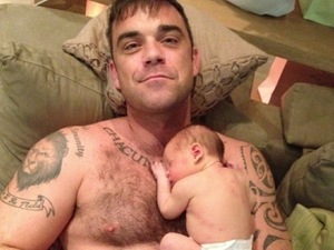 Robbie Williams reveals first picture of baby daughter Theodora Rose