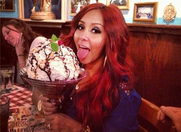Snooki poses at Buca Di Beppo in Las Vegas with giant ice cream