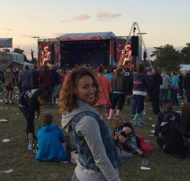 Amelle Berrabah watches Paolo Nutini perform at V Festival, Hylands Park, Essex, 17 August 2014