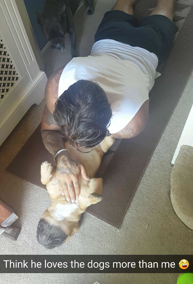 Love Island's Emma shares photo of Terry playing with two dogs, 18 July 2016