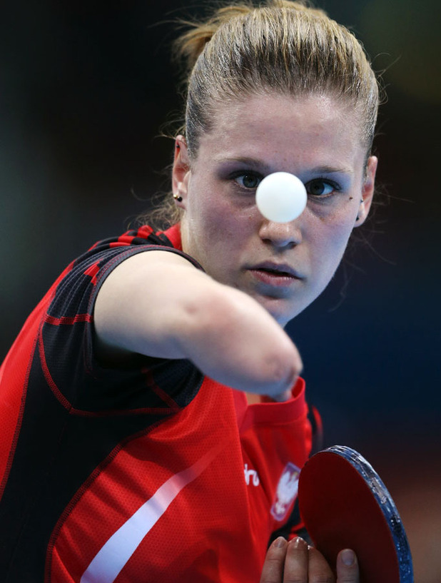 Natalia Partyka of Poland, serves against Li Jie of the Netherlands ...