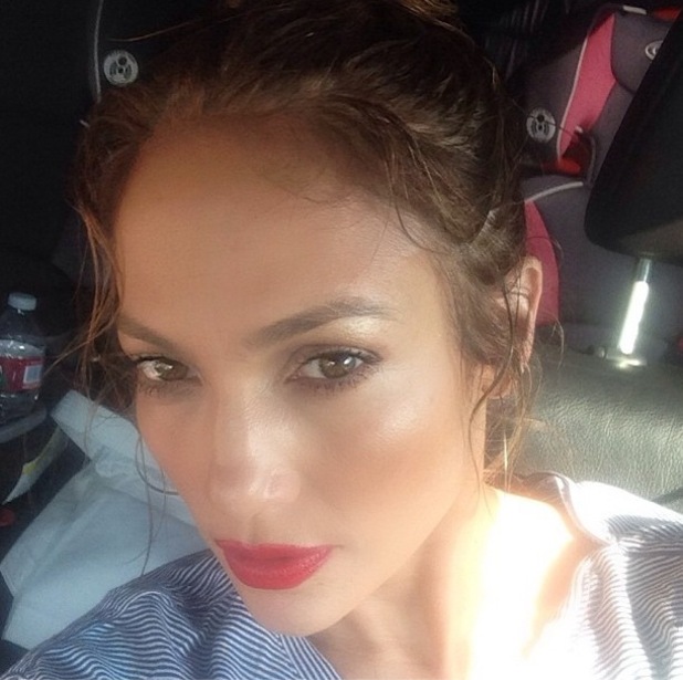 Jennifer Lopez teams fresh, dewy skin with bold red lips - get the look ...